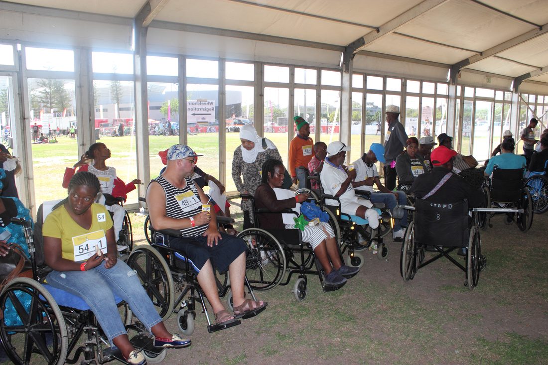 Wheelchair participants and supporters at a Cape Town APD community cycling event